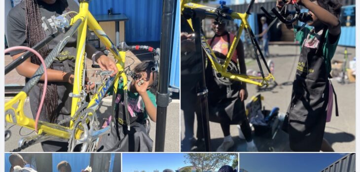 Women learning bicycle repair skills during a practical workshop at the Bicycle Mechanics Institute in South Africa.